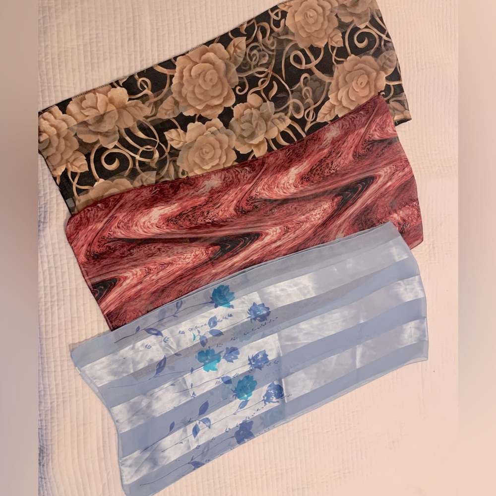 Lot of 3 scarves. All the same size and style. Tags removed. Polyester.